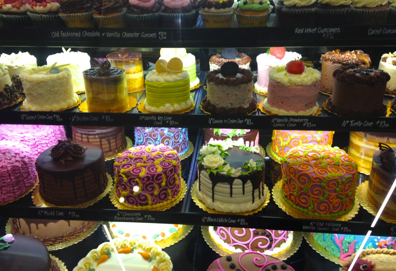 A display of the different Whole Foods cakes